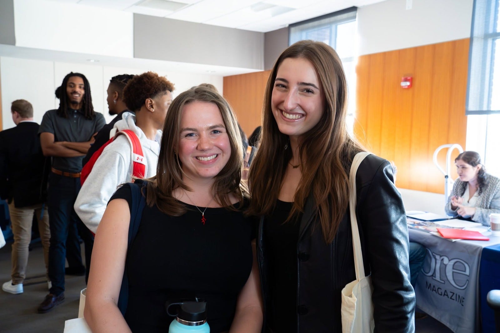 Two Merrill students posing at the 2024 career fair
