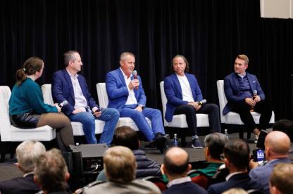 Maryland men's soccer coach Sasho Cirovski and other guests on stage at the 2025 Povich Symposium