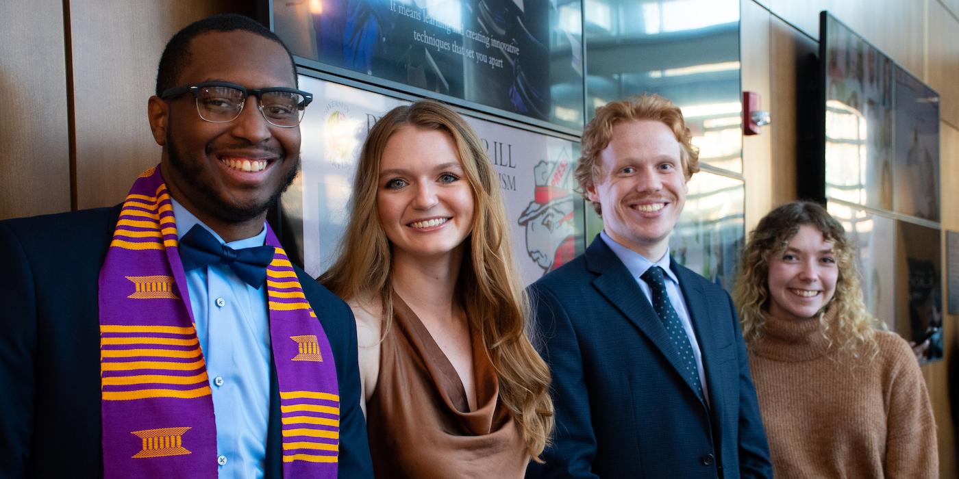 Four Merrill College students in the atrium at Knight Hall